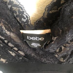 BeBe black dress with nude